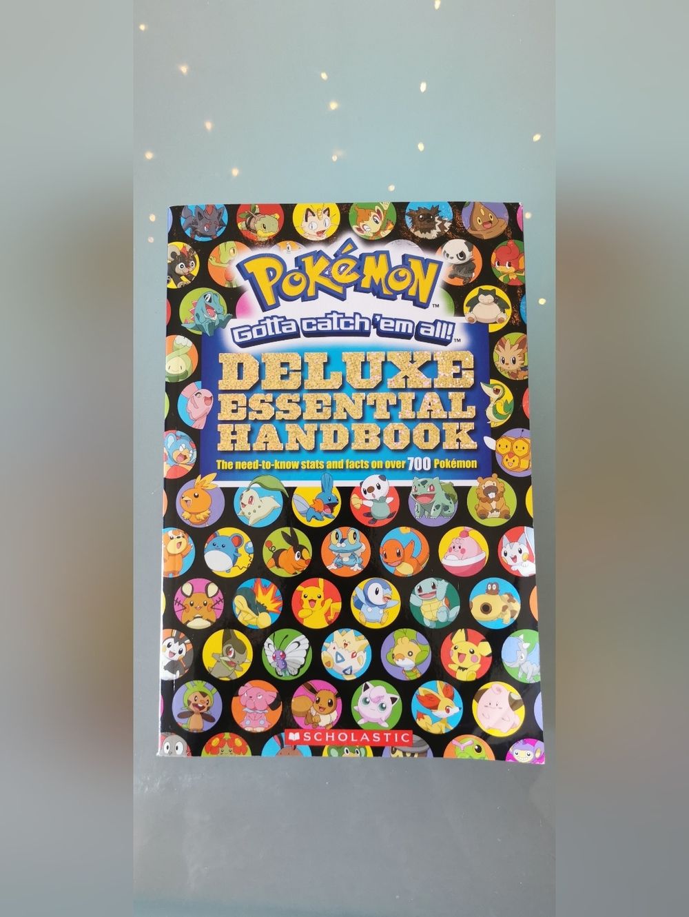 Pokemon Deluxe Essential Handbook - Black, Blue, Gold, Multicolor